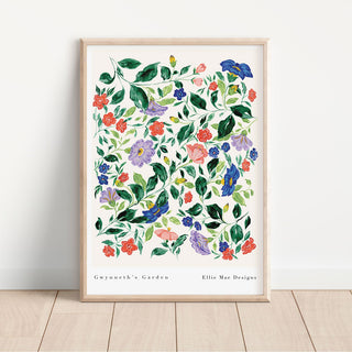 A framed art print featuring a hand-painted floral pattern with various flowers in colors such as red, blue, and green, with the text 'Gwynneth's Garden - Ellie Mae Designs' at the bottom.
