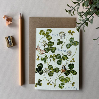 greeting card featuring a watercolor clover design with the words 'Have a Happy Birthday' 