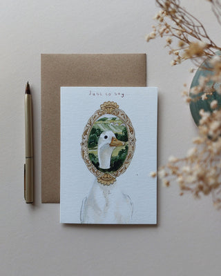 Hand painted vintage style runner duck with its head in a framed piece of art with text reading ' just to say' 