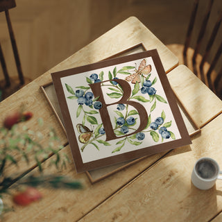 Letter B botanical alphabet art print featuring hand-painted blueberry and butterflies  in chocolate brown and soft pink. 