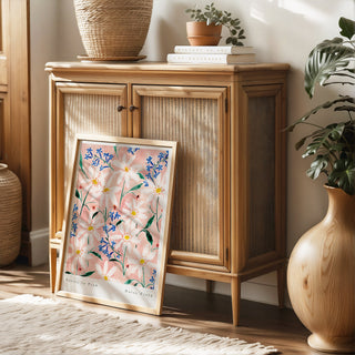 pink and white wildflower art print styled against ratten furniture