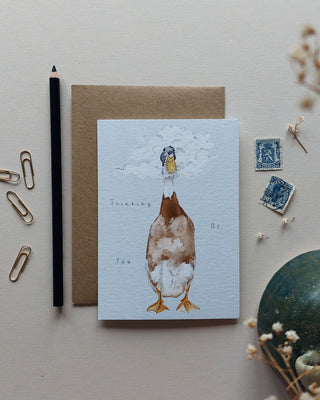 Thinking of you card with illustrated runner duck with his head in the clouds 
