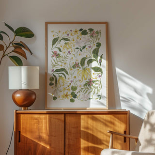Ylang ylang flowers, chamomile, neroli and other natural essence wildflowers entwined painting called botanical whisper styled in light oak frame 