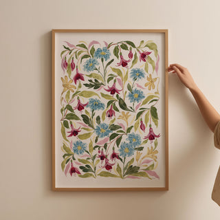 fuchsia print styled in a thin light oak frame in a2 against a blank wall