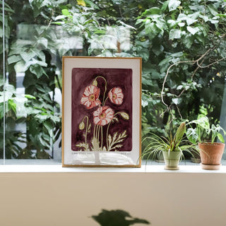 Plum coloured painted background with pink poppy flowers and text reading  floral studies: Poppy No.8 styled against greenery