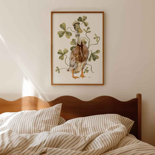 Illustrated indian runner duck wearing vintage tweed bow tie and hat surrounded by clover leaves. Perfect wall art for country vintage inspired home.
