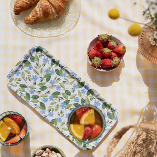blue floral tray picnic flatlay, tray holding a drink