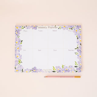 lilac blooms a4 weekly desk planner with 50 tear off pages.