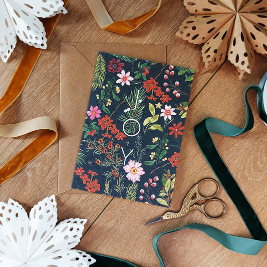 JOY christmas floral foliage a6 greeting card paired with brown envelope.